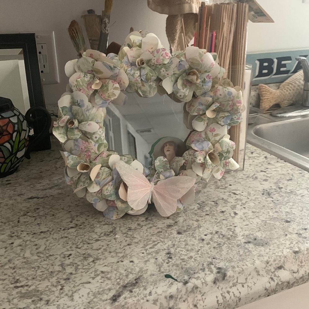 Mirror with handmade paper flowers.